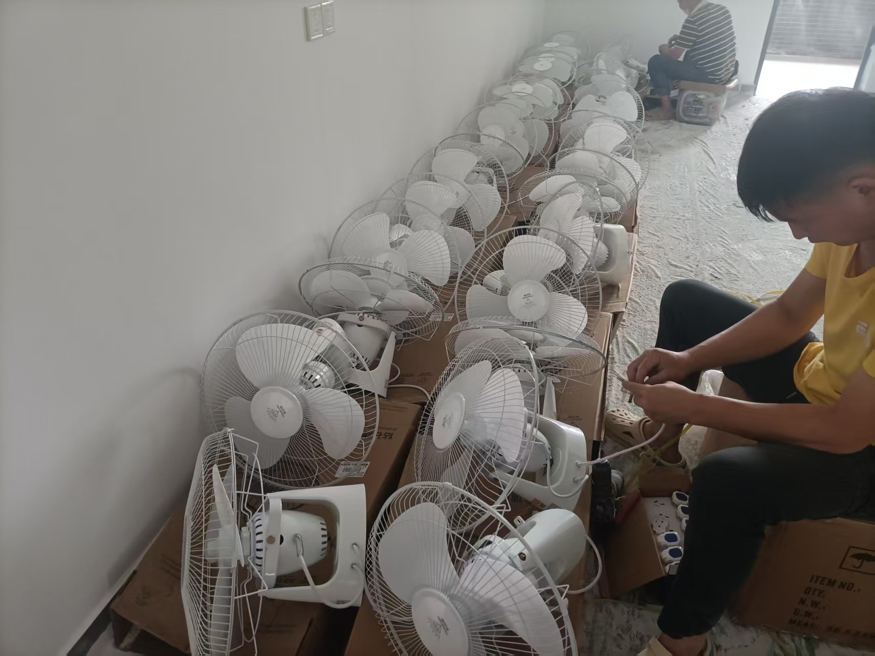 Pre-installation spot check of ceiling fans on residential dormitory project in China, compliance verification